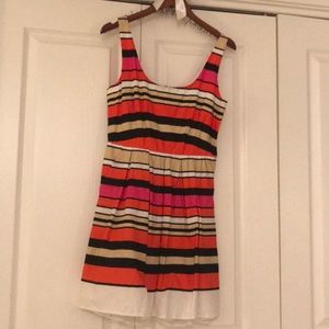 Orange, pink and black striped dress.